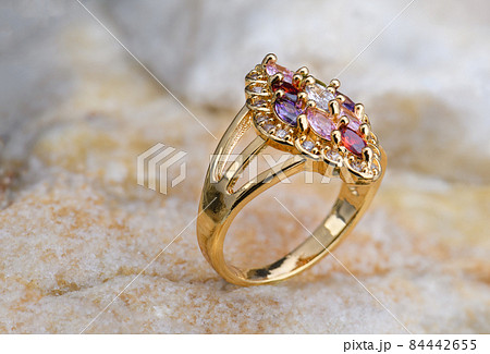 Gemstone jewelry golden ring. 84442655