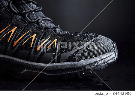 Male shoe for hiking on black background Male shoe for hiking on black background 84442906