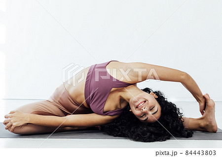 beautiful brunette woman doing yoga asana gymnastics beautiful brunette woman doing yoga asana gymnastics 84443803