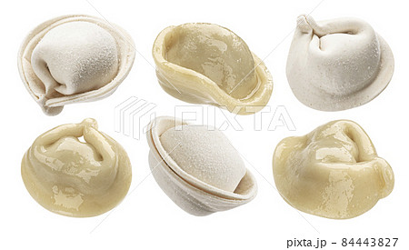 Cooked dumplings and raw pelmeni isolated on white background 84443827