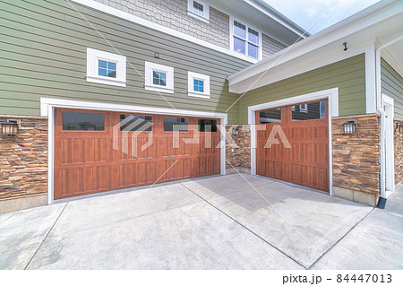 Craftsman style three-car garage parking exterior of a house Craftsman style three-car garage parking exterior of a house 84447013