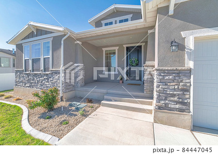 Front exterior of a house with nice front yard and garage 84447045