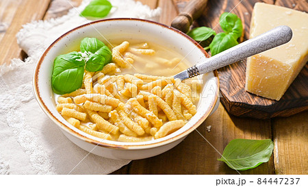 Italian soup. Parmesan Pasta Passatel. Traditional Italian food from the northern regions. 84447237