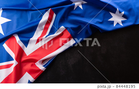Happy Australia day concept. Australian flag against dark stone background. 26 January. Happy Australia day concept. Australian flag against dark stone background. 26 January. 84448195