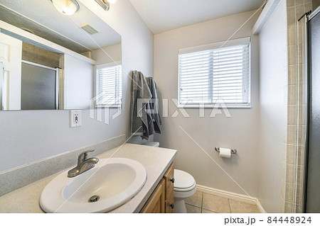 Bathroom interior with window and vanity sink unit Bathroom interior with window and vanity sink unit 84448924