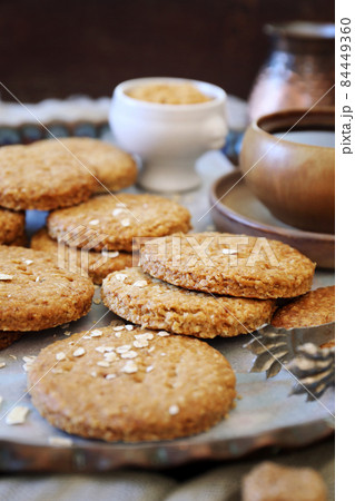 Crispy oatmeal cookies, cezve and cup of coffee for coffee break 84449360