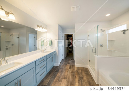Large master bathroom interior with walk in closet 84449574