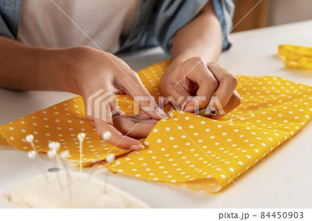 hands sewing fabric. High quality photo hands sewing fabric. High quality photo 84450903