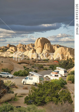 RVs at a campsite amidst huge rocks at Joshua Tree National Park on a sunny day RVs at a campsite amidst huge rocks at Joshua Tree National Park on a sunny day 84453106