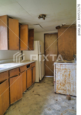 Dirty and filthy kitchen of an old uninhabitable house in Washington State Dirty and filthy kitchen of an old uninhabitable house in Washington State 84453176