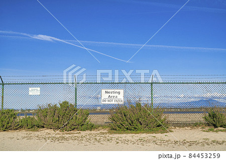 Nesting Area of Bolsa Chica Ecological Reserve with Do Not Enter warning sign 84453259