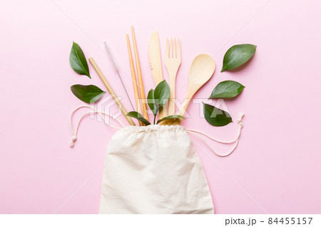 Eco friendly reusable recyclable white eco bag with kitchenware on Colored background. Concept zero waste 84455157