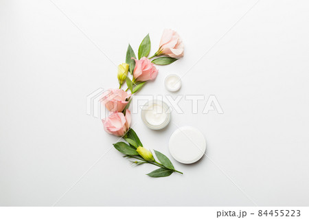 Composition with cosmetic products and beautiful roses on white background. Copy space, flat lay Composition with cosmetic products and beautiful roses on white background. Copy space, flat lay 84455223