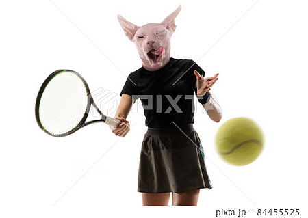 Conceptual portrait of young sportive woman, tennis player headed by cat's head in action and motion. Surrealism 84455525
