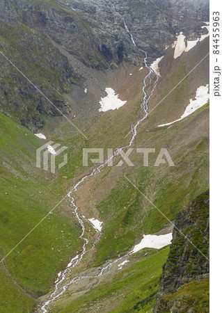 Typical alpine landscape of Swiss Alps near Sustenstrasse, Urner Alps, Canton of Bern, Switzerland Typical alpine landscape of Swiss Alps near Sustenstrasse, Urner Alps, Canton of Bern, Switzerland 84455963