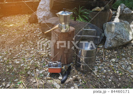 Pinto name of camping pot for cooking with moka pot coffee maker on a mountain day. Pinto name of camping pot for cooking with moka pot coffee maker on a mountain day. 84460171