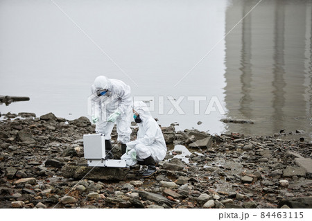 Two Workers at Industrial Disaster Site 84463115
