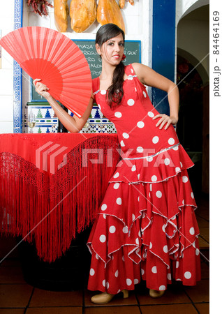 tipical spanish dancers with flamenco dresses in a bar tipical spanish dancers with flamenco dresses in a bar 84464169