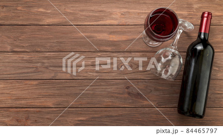wine bottle wooden background. High quality photo wine bottle wooden background. High quality photo 84465797
