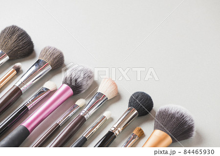 various makeup brushes arranged row white backdrop. High quality photo various makeup brushes arranged row white backdrop. High quality photo 84465930