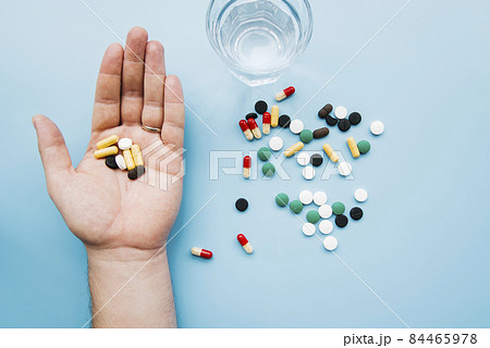 top view hand holding pills. High quality photo top view hand holding pills. High quality photo 84465978