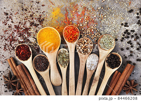 Colorful mix of herb and spice varieties: curry, coriander, turmeric, cumin, paprika, pepper, mustard, salt, thyme, cardamon, oregano, saffron, cinnamon; food ingridients background Colorful mix of herb and spice varieties: curry, coriander, turmeric, cumin, paprika, pepper, mustard, salt, thyme, cardamon, oregano, saffron, cinnamon; food ingridients background 84466208