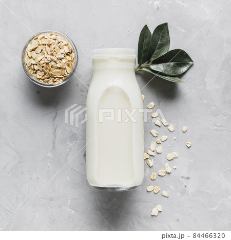 top view milk bottle with oatmeal. High quality photo top view milk bottle with oatmeal. High quality photo 84466320