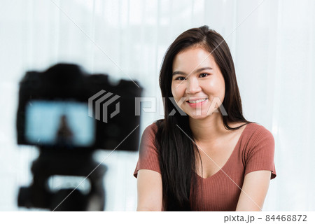 Beautiful woman blogger with live recording talking video online videoblog channel 84468872