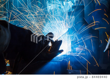 Industrial Worker at the factory welding closeup Industrial Worker at the factory welding closeup 84469440