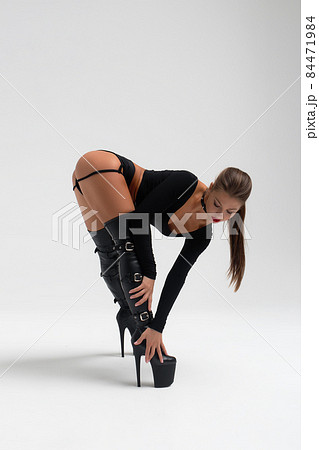 Slim woman in sexy lingerie and boots 84471984