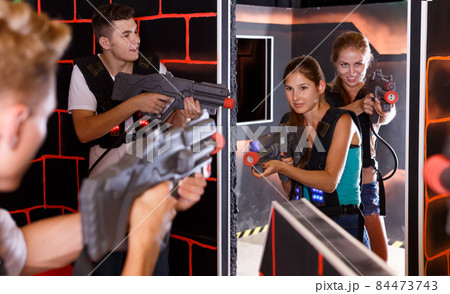 Friendly Laser tag players playing in teams Friendly Laser tag players playing in teams 84473743