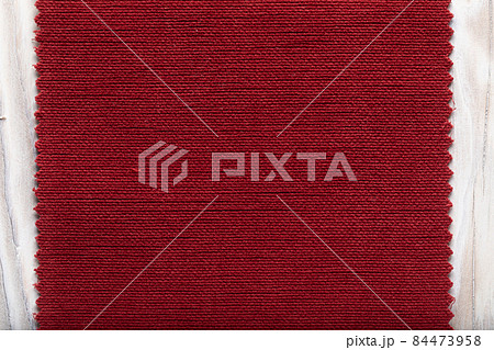 tissue structure closeup. fiber texture polyester close-up. fine grain felt red fabric background tissue structure closeup. fiber texture polyester close-up. fine grain felt red fabric background 84473958