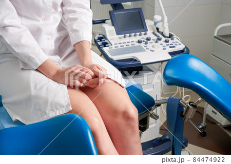 Woman at gynecologist office sitting and waiting for a doctor with test results Woman at gynecologist office sitting and waiting for a doctor with test results 84474922