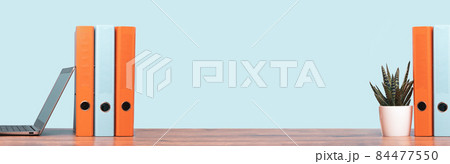 Colorful document binders or lever arch file on a shelf or desk banner Colorful document binders or lever arch file on a shelf or desk banner 84477550