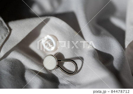 button extender shown on a white dress shirt to increase size button extender shown on a white dress shirt to increase size 84478712