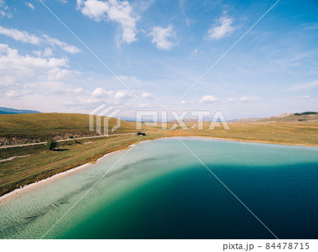 Clear water of Lake Vrazje against the blue sky. Montenegro 84478715