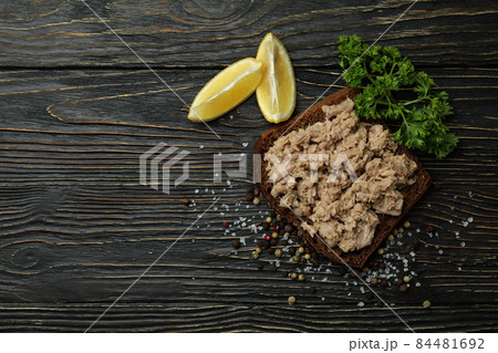 Sandwich with canned tuna on wooden background Sandwich with canned tuna on wooden background 84481692