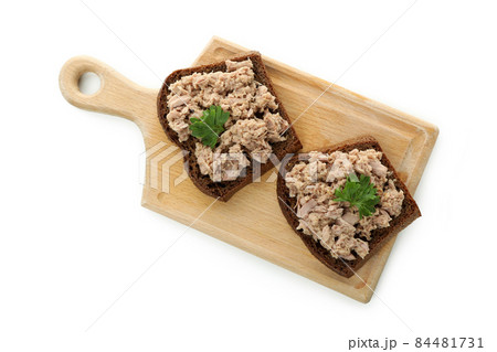 Board with sandwiches with canned tuna isolated on white background 84481731