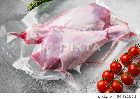 Vacuum packed turkey meat, on gray stone table background Vacuum packed turkey meat, on gray stone table background 84481951