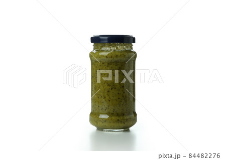 Jar of Pesto sauce isolated on white background Jar of Pesto sauce isolated on white background 84482276