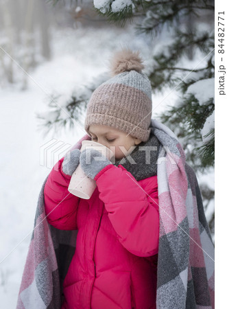 Child in winter. A little girl in the winter outside. 84482771