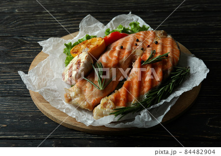 Concept of tasty eating with grilled salmon, close up Concept of tasty eating with grilled salmon, close up 84482904