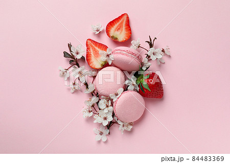 Concept of tasty macaroons on pink background Concept of tasty macaroons on pink background 84483369