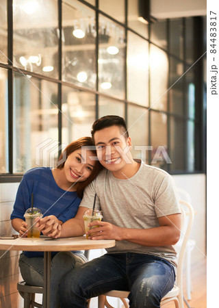 Portrait Of Happy Couple With Drinks Portrait Of Happy Couple With Drinks 84483817