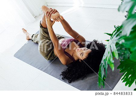 beautiful woman doing yoga asana gymnastics at home 84483833