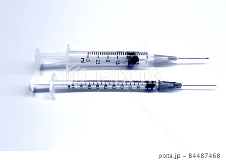 1 ml and 3 ml plastic syringe with needle isolated on the white background, blue tone color 1 ml and 3 ml plastic syringe with needle isolated on the white background, blue tone color 84487468