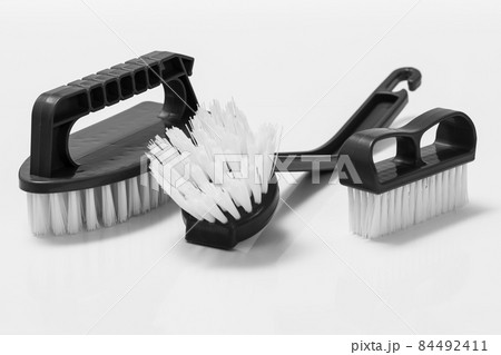 Plastic brushes for cleaning on white background. Plastic brushes for cleaning on white background. 84492411