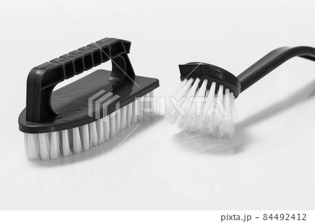 Plastic brushes for cleaning on white background. Plastic brushes for cleaning on white background. 84492412
