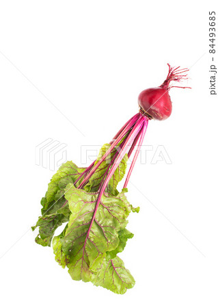 Beet vegetable with green tops on a white background, isolate. Agriculture 84493685
