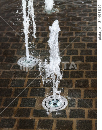 Short exposure photo of a few small fountains in Kouvola, Finland on a summer day. 84493810